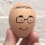 An egg with a face drawn on it.